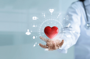 Medicine doctor holding red heart shape in hand with medical icon network