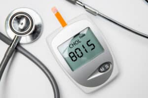 medical device for measuring cholesterol with stethoscope on the table