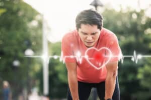 runner athlete chest injury and pain. sport man having chest pain after running in the park
